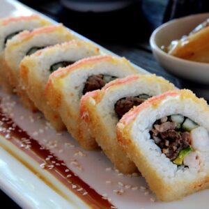 GITANO ROX: Camarón, Empanizados, Pepino, Aguacate y Espinaca, Salsa Anguila.